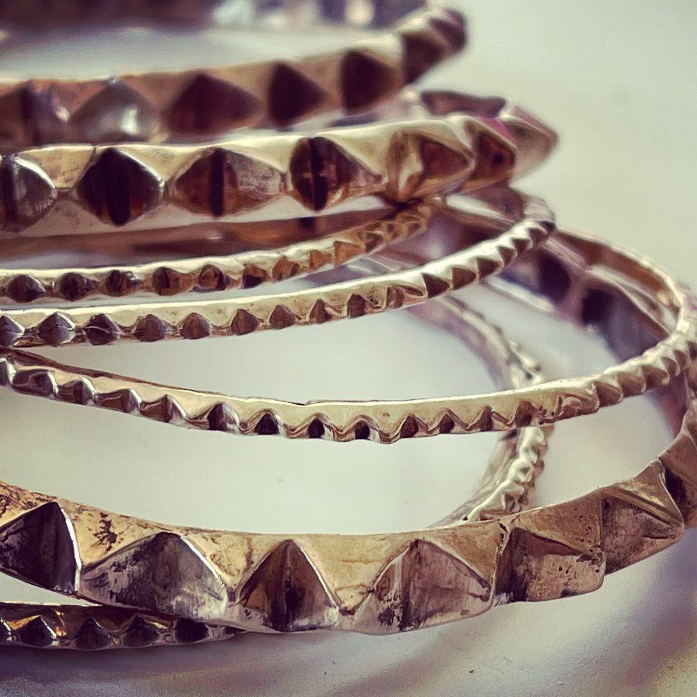 Pero bangle stack in bronze by Lotte Leopard